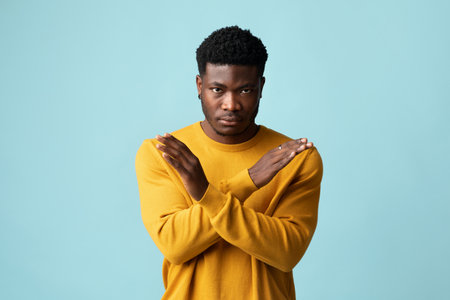 Serious african american guy in casual saying no