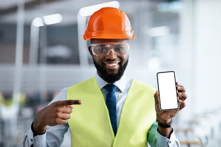 Construction Worker Shows Mobile Device While in a Work Site During Daylight Hours
