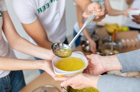 Volunteers Provide Hot Soup for Homeless at Community Charity Donation Center