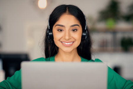 Closeup of beautiful woman attending online course, using laptop