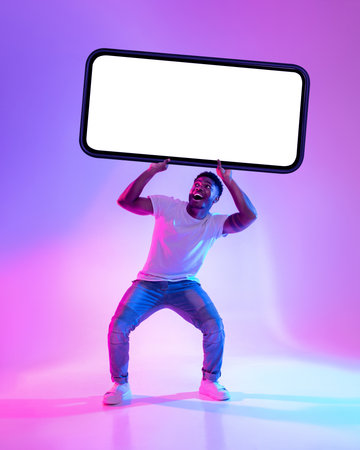 Black Man Showcases Large Smartphone in Colorful Neon Light Setting