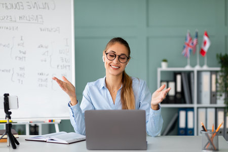 Engaging Online English Teacher Conducts Interactive Lesson With Studentsの写真素材