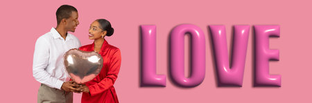 Couple Holding Heart-Shaped Balloon in Studio Against Pink Background Celebrating Loveの写真素材