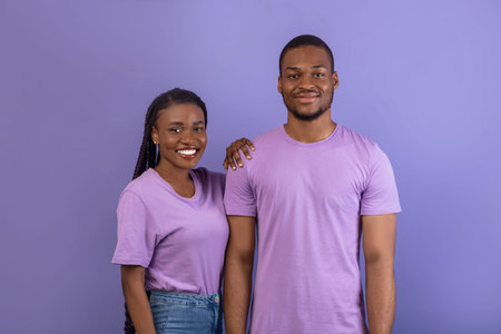 African American man and woman posing at studio