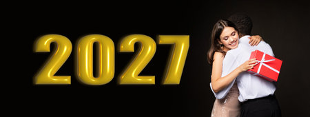 Couple Celebrates New Year With Hug and Gifts in 2027 Collageの写真素材