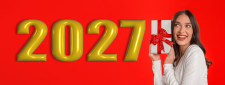 Collection of a Woman Holding a Gift Box With Backdrop for Celebrationの写真素材