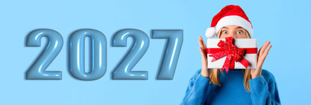 Celebration of New Year 2027 With Holiday Spirit and Gift Wrap in the Backgroundの写真素材