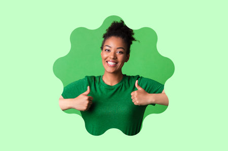 Smiling Person Giving Thumbs up in a Green Background Collage With Bright Colorsの写真素材