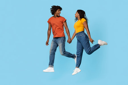 Happy black man and woman in love spending time together