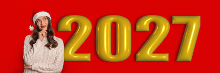 Happy Holidays in 2027 With a Festive Background and a Smiling Person in a Winter Hatの写真素材