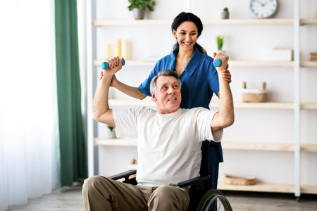 Man Using a Wheelchair Exercises With Support From a Healthcare Professional