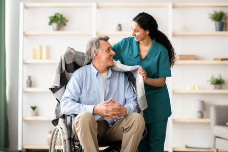 Caregiver Assisting a Man Using a Wheelchair in a Bright Indoor Setting With Shelves and Plants