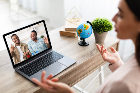 Tour Agent Video Calling Customers Having Online Consultation In Office