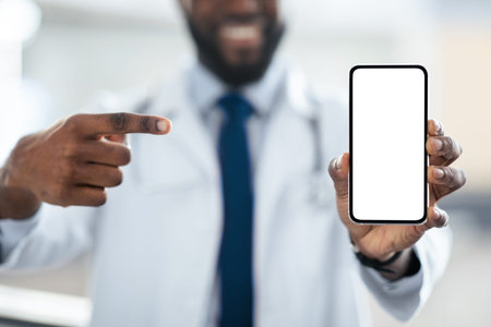 Doctor Shows Smartphone With Blank Screen Indoors in a Medical Setting During Daytimeの写真素材