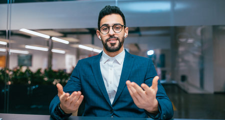 Business Professional Speaking During a Meeting in a Modern Office Setting in the Afternoonの写真素材