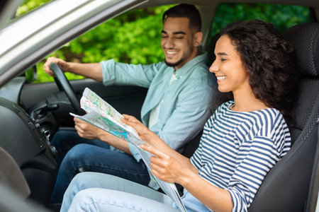Young loving man and woman having car trip together