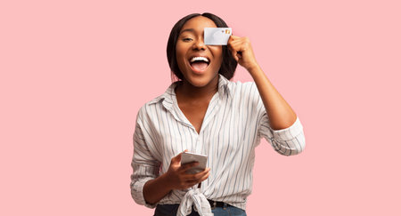 Woman Holding Smartphone And Credit Card Posing, Pink Background, Panoramaの写真素材