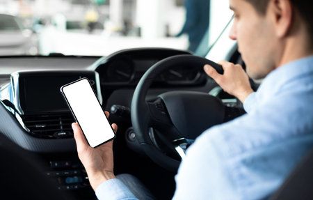 Man Using Smartphone Sitting In Car In Auto Center