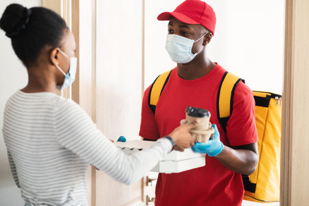 Customer Receiving Coffee And Pizza From Courier Wearing Mask Indoor