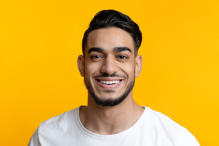 Closeup portrait of cheerful arab guy smiling at camera