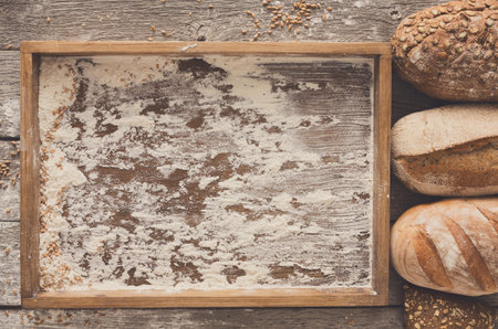 Bread bakery background. Brown and white wheat grain loaves comp