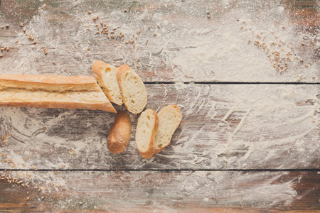 Bakery concept background. White sliced bread and knife