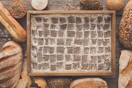 Bread bakery background. Brown and white wheat grain loaves, che