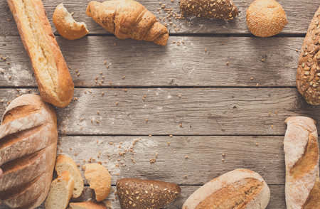 Bread background with copy space on rustic wood