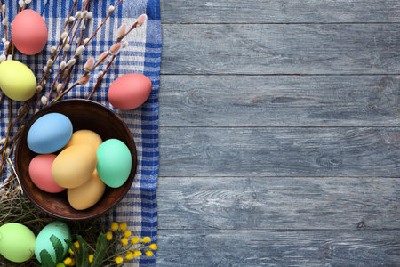 Colorful Easter Eggs Arranged on a Rustic Table With Spring Decorations and Flowers
