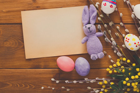 Colorful Easter Decorations on a Wooden Table With Eggs and a Stuffed Bunny