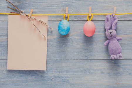 Colorful Easter Decorations Hanging on a String With a Soft Background