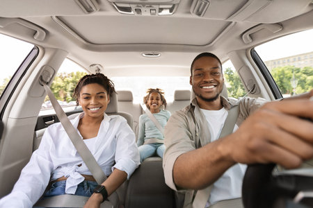 Cheerful Black Family Posing Sitting In New Automobile