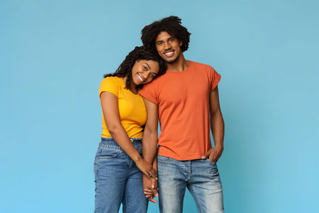 Loving black lady bonding with her happy boyfriend