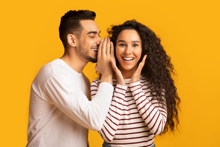 Young Man Sharing News With His Excited Girlfriend