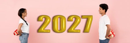 Collage of Two People Holding Gifts in Front of the Year 2027 on a Pink Backgroundの写真素材