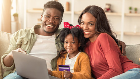 Family Enjoys Shopping Together at Home During a Relaxed Afternoonの写真素材