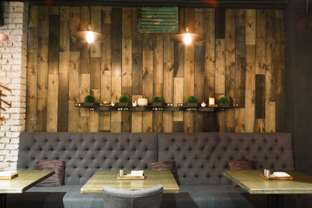Modern Restaurant Interior With Wood Accents and Cozy Seating Arrangementの写真素材