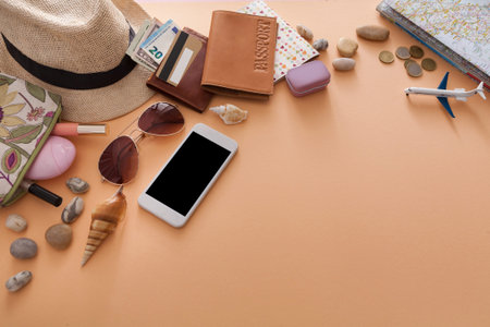 Travel Essentials Arranged on a Table for a Journey Preparation Ahead of a Summer Tripの写真素材