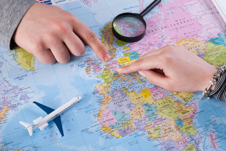 People Plan Travel by Pointing at a Map and Using a Toy Airplane on a Table in a Room