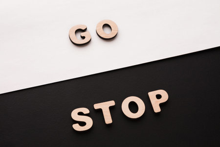 Words Go and Stop Placed on Contrasting Backgrounds for Clear Visibilityの写真素材