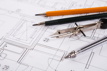 Collection of Drawing Tools on Architectural Plans for Design Work in a Workspace Setting