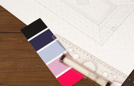 Design Tools and Color Samples Arranged on a Table for a Creative Project in Progress