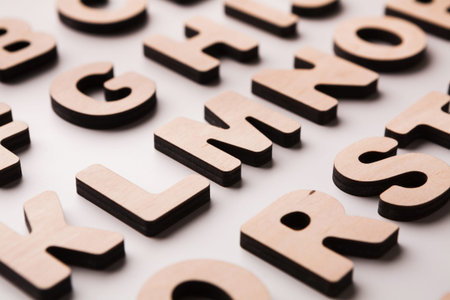 Wooden Letters Scattered on a Surface for Educational Activities and Creative Projects