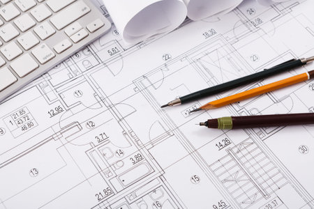 A Collection of Design Plans is Spread out on a Workspace