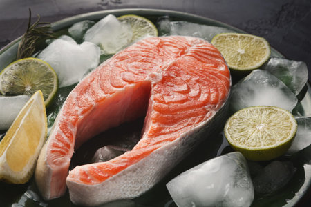 Fresh Salmon on Ice With Lemon and Lime Ready for Cooking in a Kitchen Setting