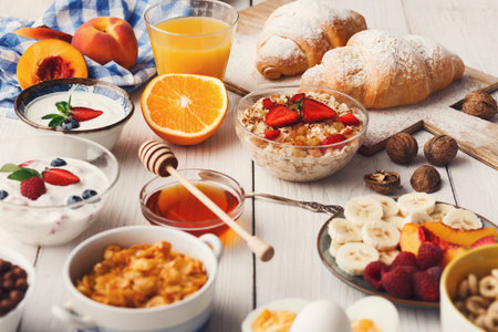 Breakfast Collage With Fruit, Yogurt, and Baked Goods on a Tableの写真素材