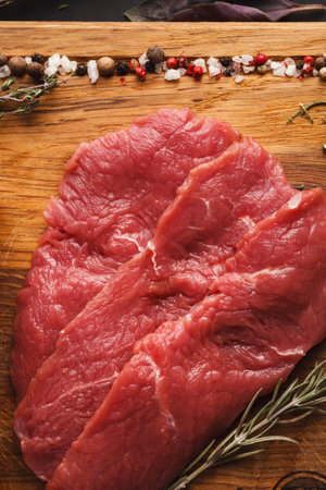 Collection of Raw Meat on Wooden Board With Spices and Herbs for Cooking