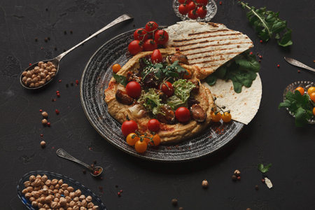 Collection of Food Items Served on a Plate With Various Colors and Textures Arranged on a Tableの写真素材
