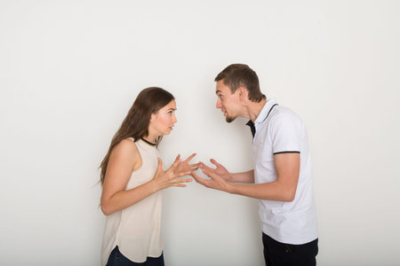 Couple in an Argument in a Plain Indoor Setting During Daytime