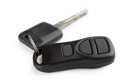 Collection of Car Keys and Remote on a White Background With Shadows Cast